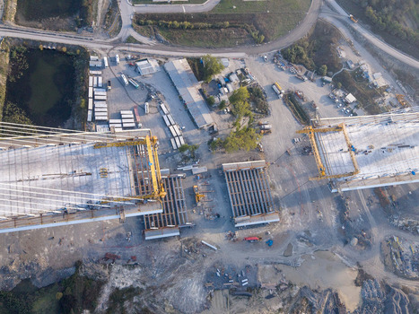 Aerial view of bridge construction site with heavy machinery and concrete segments in Istanbul Istanbul Turkiye.