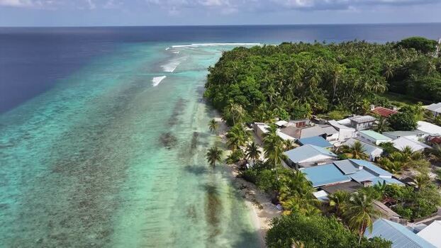Aerial view of tropical island Maalhos with turquoise reef and palms Maldives. Aerial view of tropical island Maalhos with turquoise reef and palms Maldives.