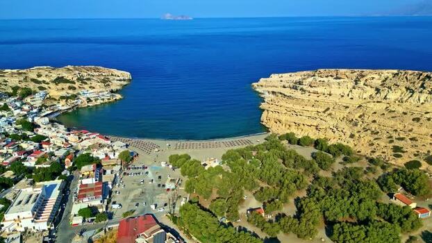 Aerial view of Matala beach and cliffs in Crete Greece.