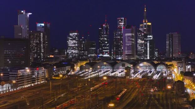 Aerial view of the illuminated Hauptbahnhof and skyline in Germany.