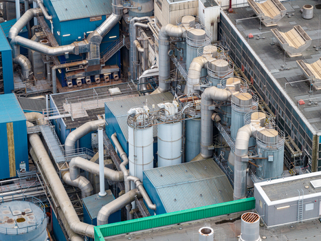 Aerial view of Klarwerk Ruhleben featuring complex industrial piping large cylindrical tanks and metal structures at the wastewater treatment plant in Berlin Berlin Germany.