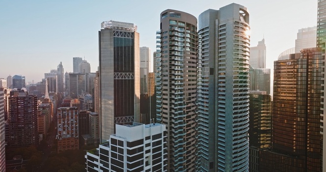 Aerial view of modern skyscrapers and glass office towers in the urban skyline of Sydney New South Wales Australia. Aerial view of modern skyscrapers and glass office towers in the urban skyline of Sydney New South Wales Australia.