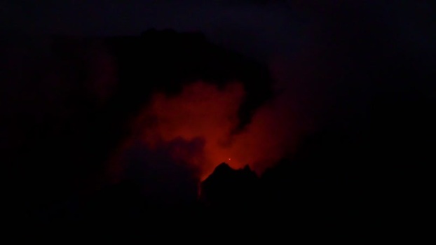 View of Stromboli volcano erupting at night Italy.