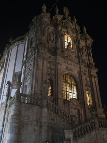 View of the illuminated baroque facade of the Clerigos Church with its intricate stone carvings and grand staircase at night in Porto Porto District Portugal. View of the illuminated baroque facade of the Clerigos Church with its intricate stone carvings and grand staircase at night in Porto Porto District Portugal.