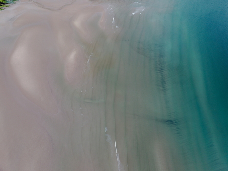 Aerial view of turquoise waters and textured sand ripples at Gruinard Bay Gruinard Scotland United Kingdom. Aerial view of turquoise waters and textured sand ripples at Gruinard Bay Gruinard Scotland United Kingdom.