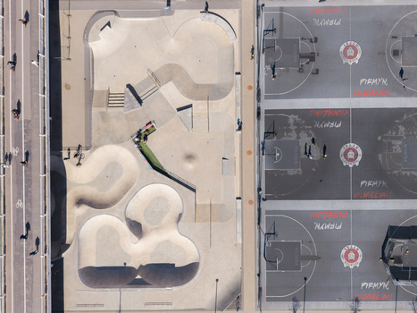 Aerial view of Chiune Sugihara Sakura Park featuring a modern concrete skate park and basketball courts with painted markings in Vilnius Vilniaus apskritis Lithuania. Aerial view of Chiune Sugihara Sakura Park featuring a modern concrete skate park and basketball courts with painted markings in Vilnius Vilniaus apskritis Lithuania.