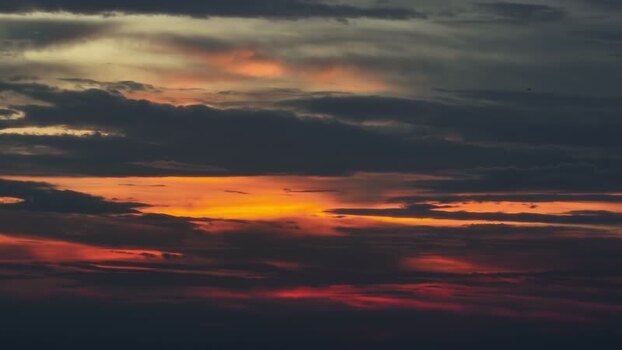 View of dramatic sunset sky with orange clouds in Bangladesh.