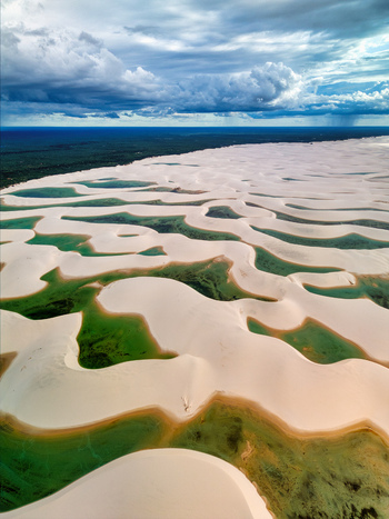 Aerial view of the white sand dunes and turquoise lagoons of Lagoa Bonita in the Lencois Maranhenses National Park in Barreirinhas State of Maranhao Brazil. Aerial view of the white sand dunes and turquoise lagoons of Lagoa Bonita in the Lencois Maranhenses National Park in Barreirinhas State of Maranhao Brazil.