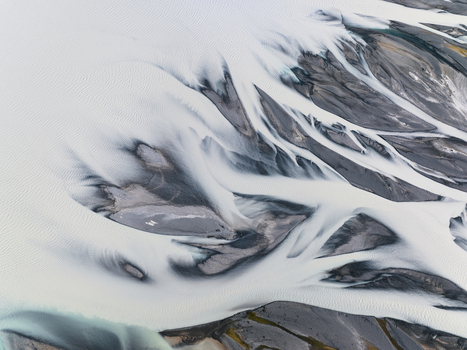 Aerial view of glacial rivers carve through the earth creating a mesmerizing tapestry of icy blues and stark grays Lake Tekapo Canterbury Region New Zealand. Aerial view of glacial rivers carve through the earth creating a mesmerizing tapestry of icy blues and stark grays Lake Tekapo Canterbury Region New Zealand.