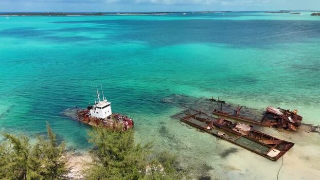 Aerial view of shipwrecks in turquoise water The Bahamas.