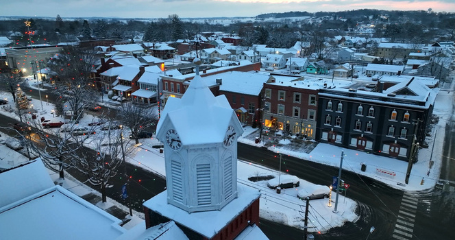 Aerial view of the historic clock tower and snow covered town square in Manheim Pennsylvania United States.