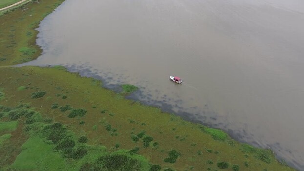 Aerial view of a boat on Lake Gregory Sri Lanka. Aerial view of a boat on Lake Gregory Sri Lanka.
