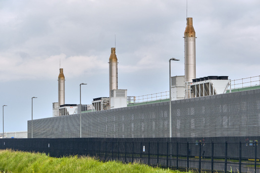 Middenmeer Netherlands 17 May 2026 View of the Microsoft data center on Agriport featuring industrial chimneys and cooling systems under a cloudy sky.