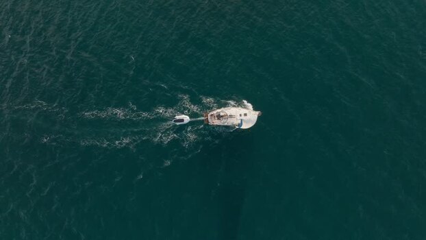 Aerial view of a boat cruising on the blue sea Italy. Aerial view of a boat cruising on the blue sea Italy.