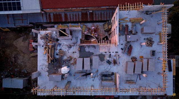 Aerial view of a construction site featuring concrete slabs building materials and scaffolding in Pancevo Vojvodina Serbia.