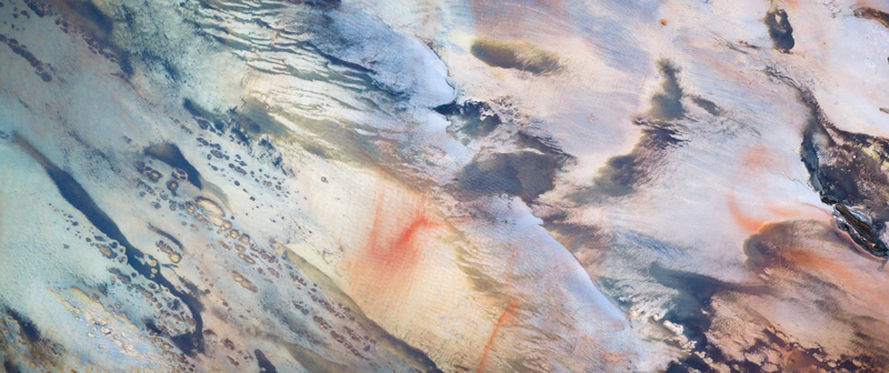Aerial view of textured earth showing a mosaic of sandy grey and reddish tones creating an abstract yet natural landscape Salt Lake City Utah United States. Aerial view of textured earth showing a mosaic of sandy grey and reddish tones creating an abstract yet natural landscape Salt Lake City Utah United States.