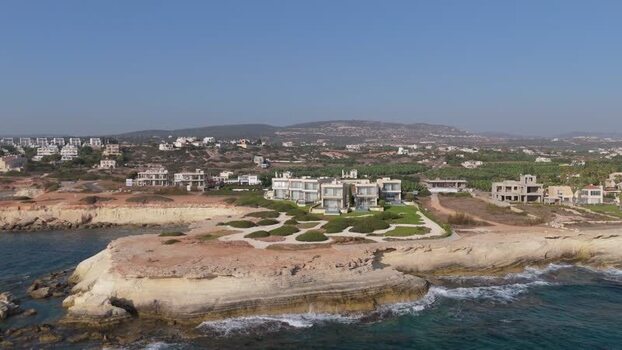 Aerial view of coastal villas on cliffs Cyprus.