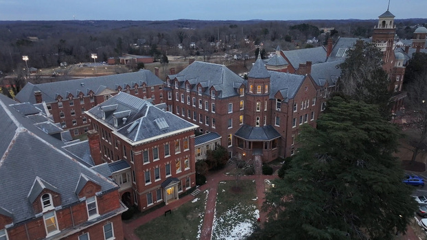 Aerial view of the University of Lynchburg campus featuring historic red brick buildings with slate roofs walkways and trees in Lynchburg Virginia United States.