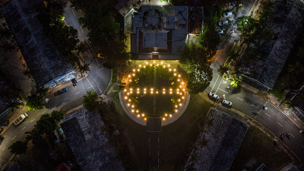 Aerial view of the illuminated Feria Ganadera circular plaza at night featuring glowing lights surrounding roads and urban buildings in Santo Domingo Distrito Nacional Dominican Republic. Aerial view of the illuminated Feria Ganadera circular plaza at night featuring glowing lights surrounding roads and urban buildings in Santo Domingo Distrito Nacional Dominican Republic.