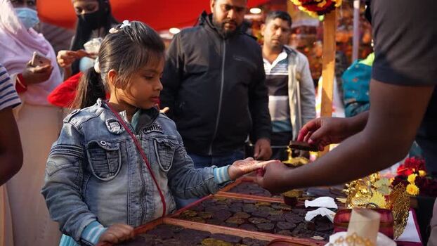 View of a girl getting henna applied at a market Bangladesh. View of a girl getting henna applied at a market Bangladesh.