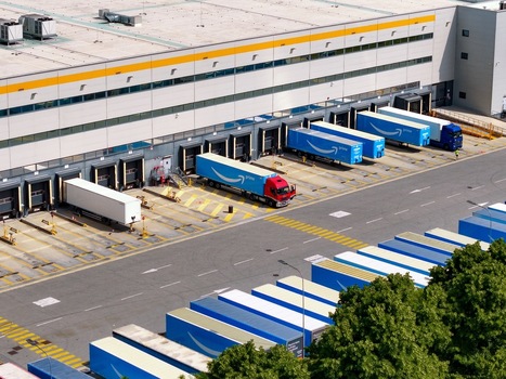 Torrazza Piemonte Italy 03 May 2026 Aerial view of the Amazon TRN1 fulfillment center with branded trucks parked at loading docks under bright daylight. Torrazza Piemonte Italy 03 May 2026 Aerial view of the Amazon TRN1 fulfillment center with branded trucks parked at loading docks under bright daylight.