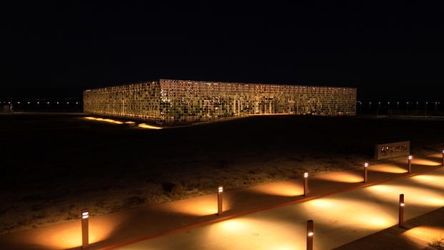 Aerial view of the Karapinar Solar Power Plant illuminated at night with rows of solar panels and pathway lighting in Karapinar Konya Turkey.