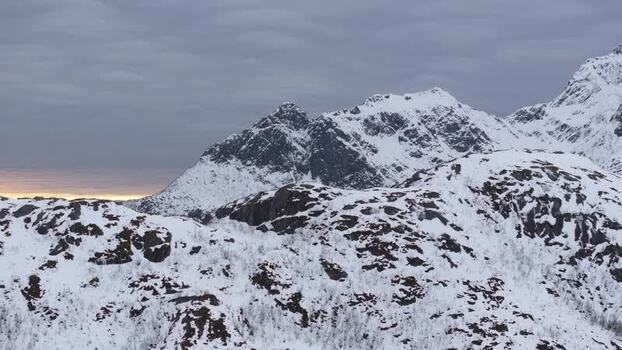 Aerial view of snow covered mountains in Lofoten Norway.