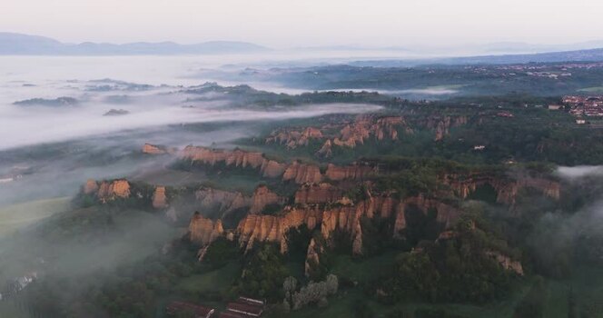 Aerial view of Balze del Valdarno cliffs shrouded in morning mist Italy. Aerial view of Balze del Valdarno cliffs shrouded in morning mist Italy.