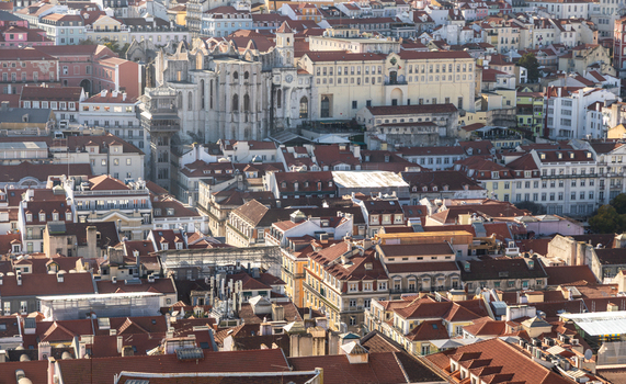 Aerial view of Carmo Convent surrounded by historic rooftops and urban architecture in Lisbon Lisbon Portugal.
