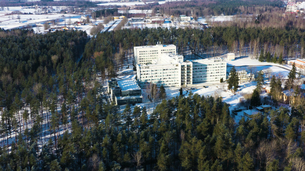 Aerial view of Vidzeme Hospital surrounded by a dense pine forest and snow covered grounds in Valmiera Latvia. Aerial view of Vidzeme Hospital surrounded by a dense pine forest and snow covered grounds in Valmiera Latvia.