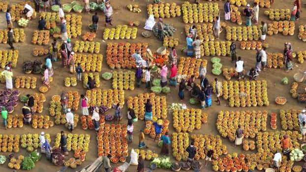 Aerial view of a bustling outdoor vegetable market Bangladesh.