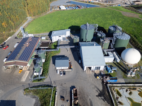 Oulu Finland 25 September 2026 Aerial view of the biogas production facility at the Rusko waste treatment center featuring large green storage tanks a white gas holder dome and solar panels on the main building roof. Oulu Finland 25 September 2026 Aerial view of the biogas production facility at the Rusko waste treatment center featuring large green storage tanks a white gas holder dome and solar panels on the main building roof.
