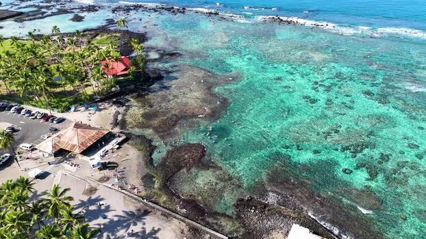 Aerial view of Kahaluu Beach Park with turquoise reef United States.