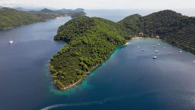Aerial view of wooded Elaphiti islands with boats Dalmatian Coast Croatia.