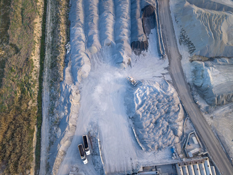 Aerial view of a large industrial quarry with piles of gravel and sand heavy machinery and trucks parked on the site Istanbul Istanbul Turkiye.