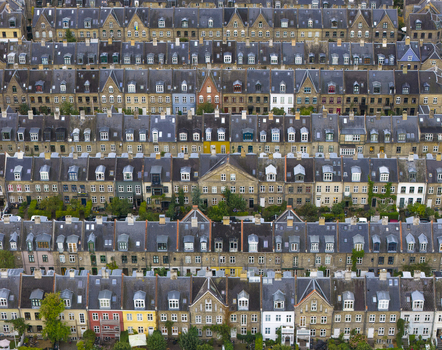 Aerial view of the historic Kartoffelraekkerne terraced houses with their distinctive gabled roofs and dormer windows in Copenhagen Denmark. Aerial view of the historic Kartoffelraekkerne terraced houses with their distinctive gabled roofs and dormer windows in Copenhagen Denmark.