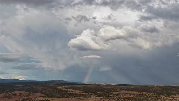 Aerial view of rainbow over high desert landscape United States.