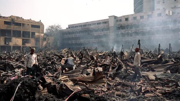 View of people among fire debris in Dhaka Bangladesh. View of people among fire debris in Dhaka Bangladesh.