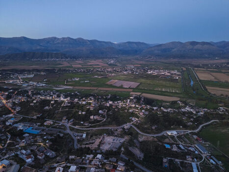 Aerial view of Saranda a coastal town nestled between rolling hills and agricultural fields in Saranda Vlore County Albania. Aerial view of Saranda a coastal town nestled between rolling hills and agricultural fields in Saranda Vlore County Albania.