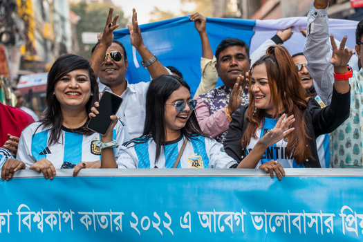Bogura Rajshahi Division Bangladesh 02 December 2022 View of football fans celebrating in Argentina jerseys with a banner during the 2022 World Cup.