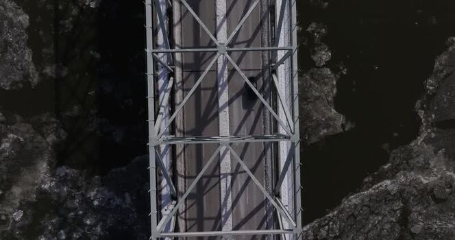 Aerial view of a truss bridge over an icy river in Cincinnati United States. Aerial view of a truss bridge over an icy river in Cincinnati United States.