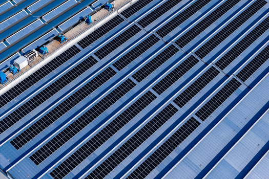 Aerial view of solar panels installed on an industrial building roof in Spoleto Umbria Italy. Aerial view of solar panels installed on an industrial building roof in Spoleto Umbria Italy.