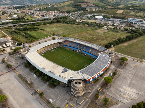 Aerial view of Stadio Riviera delle Palme with its green pitch and grandstands surrounded by the urban landscape of San Benedetto del Tronto Marche Italy.