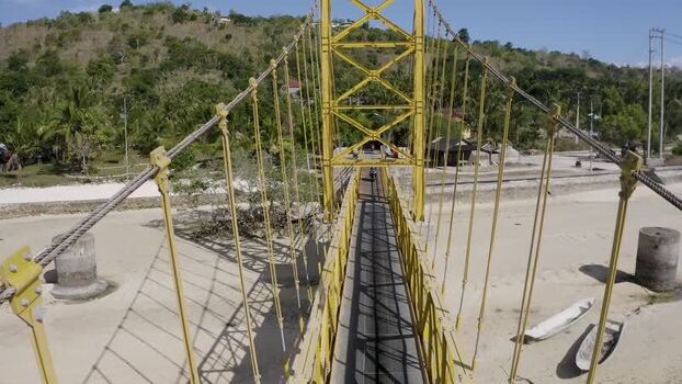Aerial view of the Yellow Bridge over a sandy beach Indonesia. Aerial view of the Yellow Bridge over a sandy beach Indonesia.
