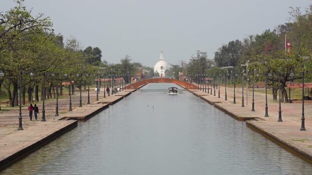 View of the World Peace Pagoda and central canal in Lumbini Nepal.
