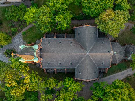 Aerial view of Erloserkirche church surrounded by lush green trees in Berlin Berlin Germany. Aerial view of Erloserkirche church surrounded by lush green trees in Berlin Berlin Germany.