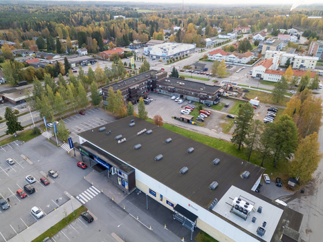 Muhos North Ostrobothnia Finland 22 September 2026 Aerial view of the supermarket area in Muhos featuring parking lots surrounding buildings and autumn trees.
