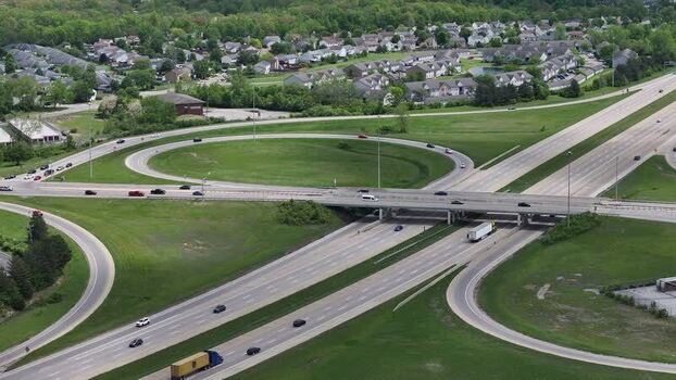 Aerial view of a highway interchange and traffic United States. Aerial view of a highway interchange and traffic United States.
