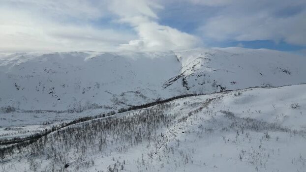 Aerial view of the snow covered mountains of Kvaloya Norway.