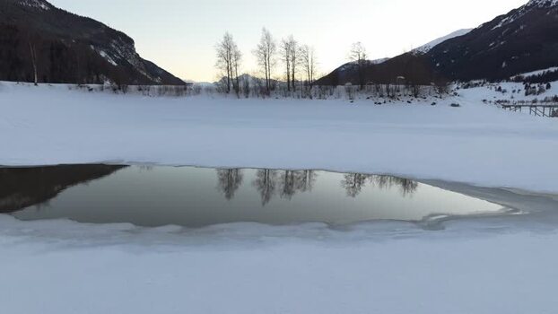 Aerial view of frozen lake in Graun im Vinschgau Italy. Aerial view of frozen lake in Graun im Vinschgau Italy.